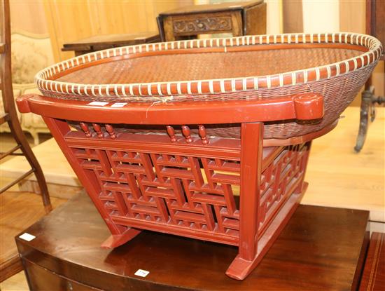 A Chinese rattan and wood cradle, W.93cm